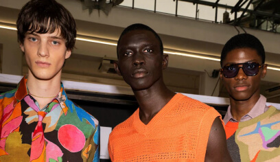 Three models in bold print fashion backstage, from Paul Smith, an Antavo loyalty customer