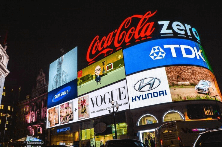 A billboard at night showing the mere exposure effect in action.