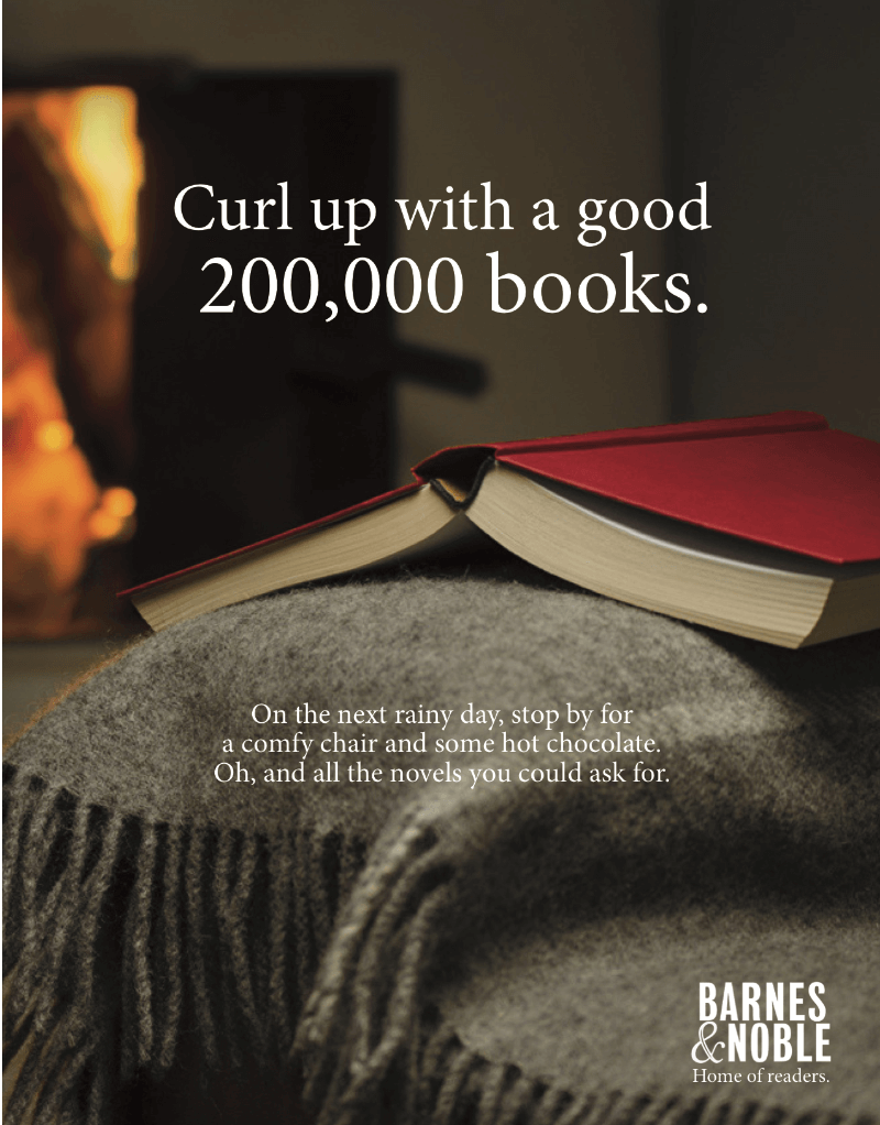 An advertisement that sets the peaceful scene of curling up by the fire on a rainy day with a good book.