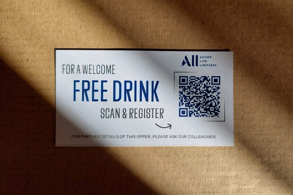 Accor promoting sign-up by offering a free drink.
