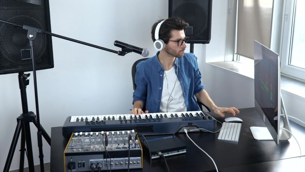 Young musician composing a track